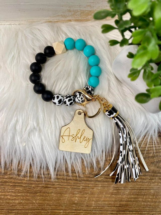 Cow tag wristlet